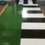 green resin flooring with striped demarcation for a pharmaceutical company