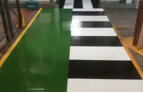 green resin flooring with striped demarcation for a pharmaceutical company