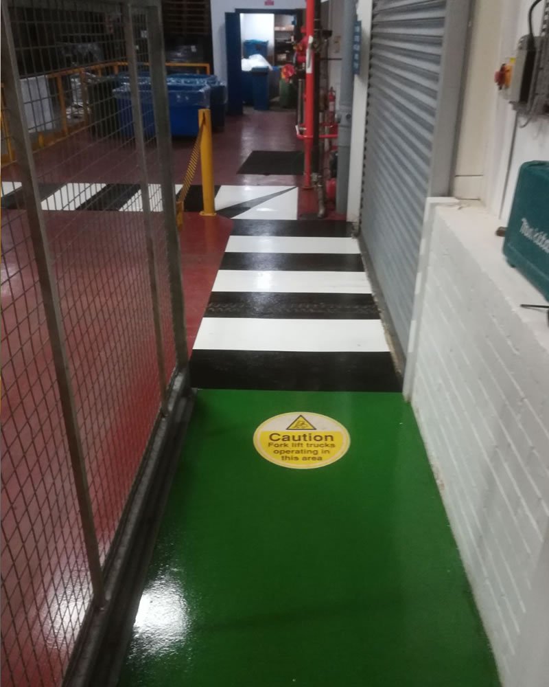 green pedestrian walkway for a company in huddersfield