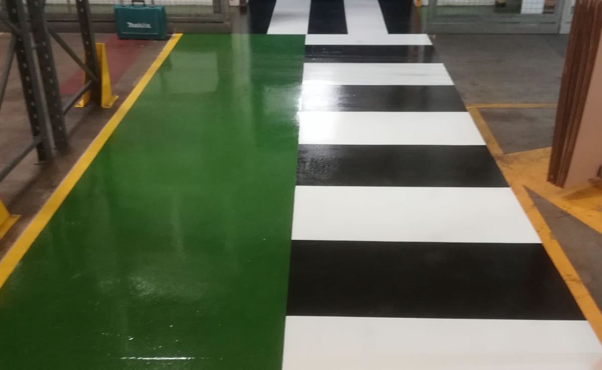 green resin flooring with striped demarcation for a pharmaceutical company