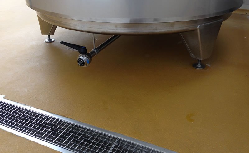 resin flooring for a brewery with a stainless steel drainage system