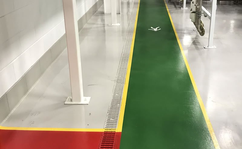 resin flooring in green creating a walkway for pedestrians